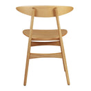 Switch The Carcher Oak Side Chair features a curved backrest and seat, angled rear legs, and a minimalist Scandinavian design. Photographed against a white background, it's ideal for any contemporary interior. 3 image