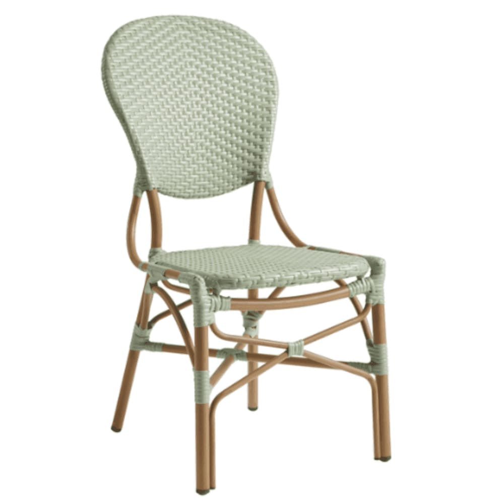 The Brittany Bistro Outdoor Side Chair features light green synthetic wicker with a rounded back and seat, set on light brown wooden legs. Stackable for convenience, it adds stylish charm to any space.