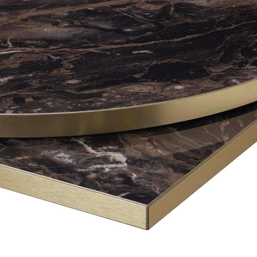 The Parisian Bistro Gold Square Marble Effect Table features a dark marble-effect top with a gold metal edge and a sturdy base, displayed slightly apart on a white background.