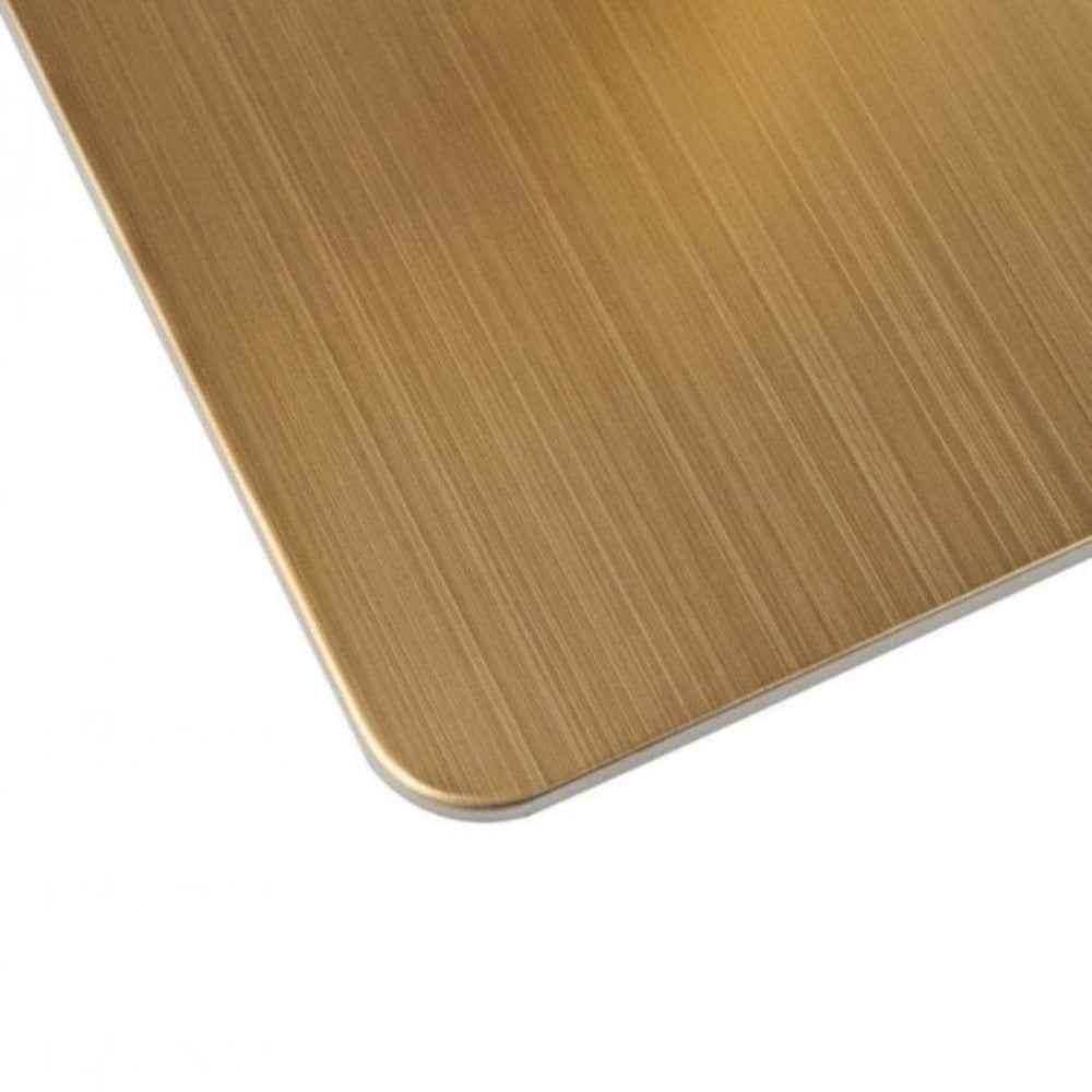 A close-up of the Zeus Brass Base Pedestal Square Table (700x700mm) with a brushed gold base and white marble effect top, displaying fine vertical texture—ideal for modern or brass cafe table designs.