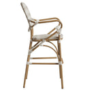 Switch Side view of the Brittany Outdoor Bistro Bar Stool, featuring a tall synthetic wicker frame, curved backrest, armrests, woven seat, and decorative white wrappings on the joints and legs for added support and style. 2 image