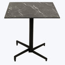 Switch A square, black Marquina Marble Outdoor Laminate Restaurant Table Top with a central metal leg branching into four feet, set against a plain white background. 2 image