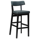 Switch The Nico Faux Leather Bar Stool - Black features a modern, minimalist design with a padded seat and backrest, four straight legs, and a footrest. 2 image