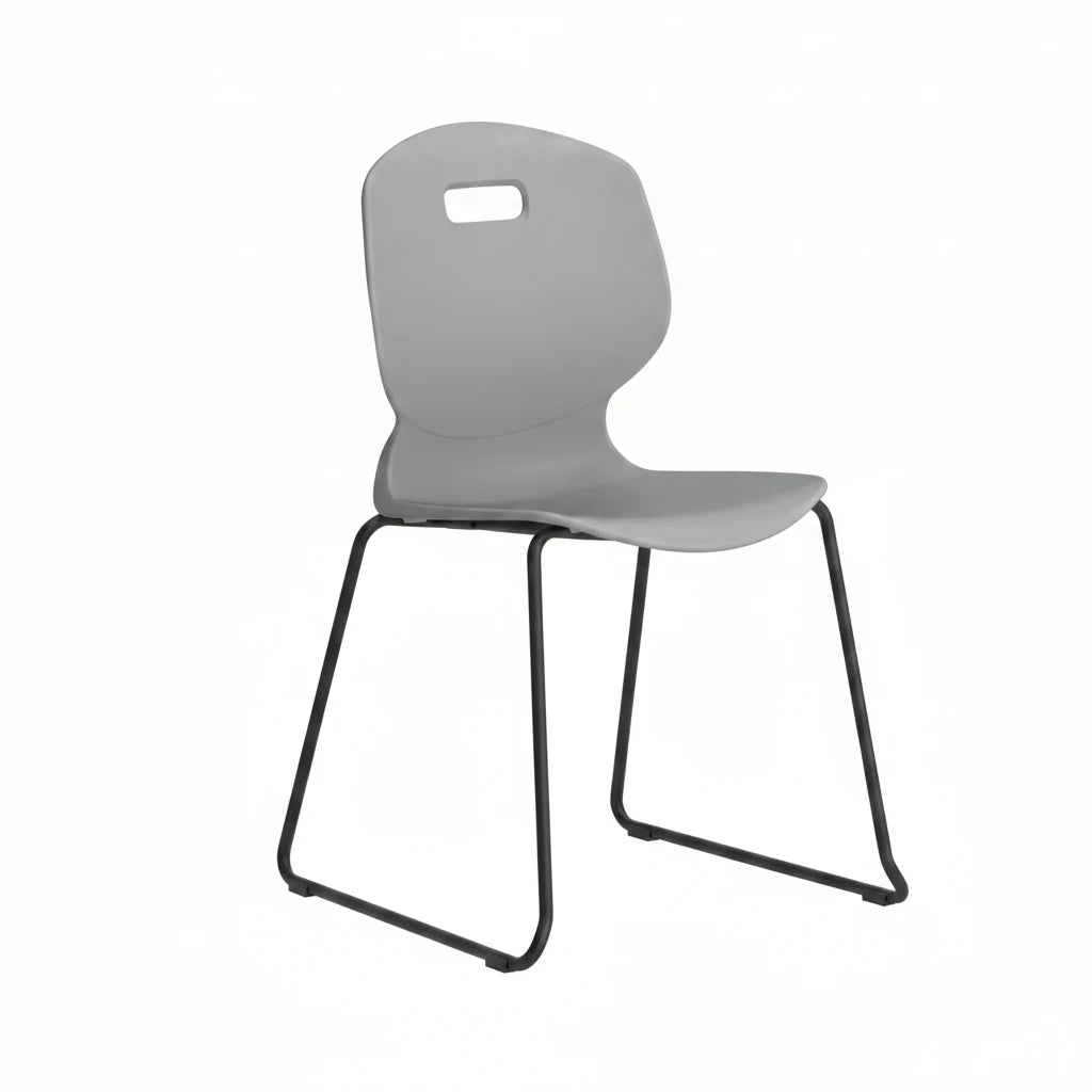 The Arc Classroom Skid Chair is a modern gray plastic educational chair featuring a curved backrest with a rectangular cutout near the top and black metal sled-style legs, shown against a plain white background.