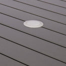 Switch Close-up of the gray slatted tabletop on the Villa Metal Square Outdoor Bar Table, featuring a round white plastic cover fitted into one board—likely concealing a hidden umbrella hole. 3 image