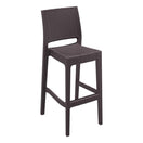 Switch The Jamaica Outdoor Stacking Bar Stool is a tall, weather-resistant resin stool in dark brown with a woven rattan-style texture, square seat, low backrest, integrated footrest, and stackable design—ideal for outdoor use. 1 image