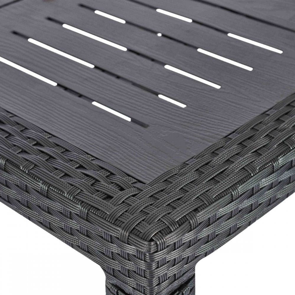 Close-up of the Geneva Outdoor Stacking Dining Table featuring a rectangular, wood-textured slatted top with a woven rattan-style border and sturdy leg. Ideal for stylish al fresco dining.