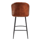 Switch The Brooklyn Upholstered Bar Stool features genuine leather, a curved backrest, and black metal legs—viewed from the back, it's ideal for stylish indoor venues. 3 image