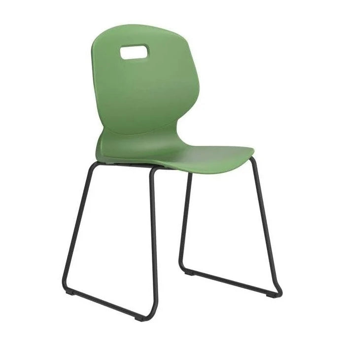 Arc Classroom Skid Chair: A modern green plastic chair with a curved seat and backrest featuring a small rectangular cutout at the top, supported by black metal sled-style legs.