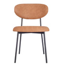 Switch Joe Metal Stacking Tan Faux Leather Side Chair with a rounded backrest and seat upholstered in tan faux leather, supported by four thin black metal legs. 3 image