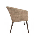 Switch A side view of the Hanover Outdoor Stacking Sofa—a modern, minimalist piece featuring a sloped backrest, dark slender legs, and a natural woven look crafted from all-weather resin wicker. 3 image