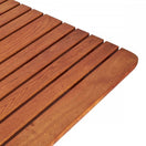 Switch Close-up of the Arch Outdoor Folding Picnic Table - 4 Seater Rectangle, featuring narrow, evenly spaced robinia wood slats with rounded edges and a smooth, polished warm brown finish. 2 image