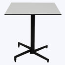 Switch The Chalk White Marble Outdoor Laminate Restaurant Table Top features a scratch-resistant, high-pressure laminate surface and a sturdy black metal pedestal base with four feet—perfect for any outdoor commercial space. 2 image