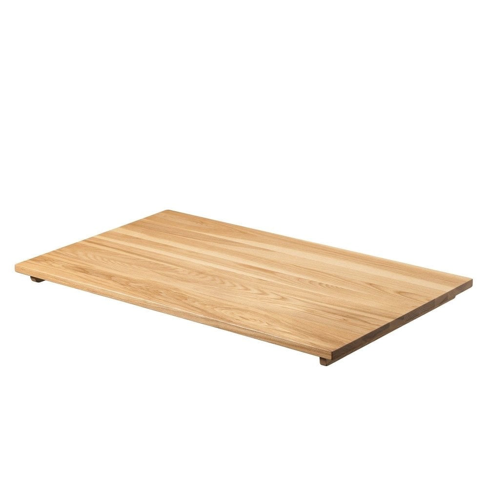 The Serranto Oak Stain Solid Ash Restaurant Table Top (25mm) features a smooth, light brown finish and a rectangular design that complements modern dining tables, shown here on a white background.