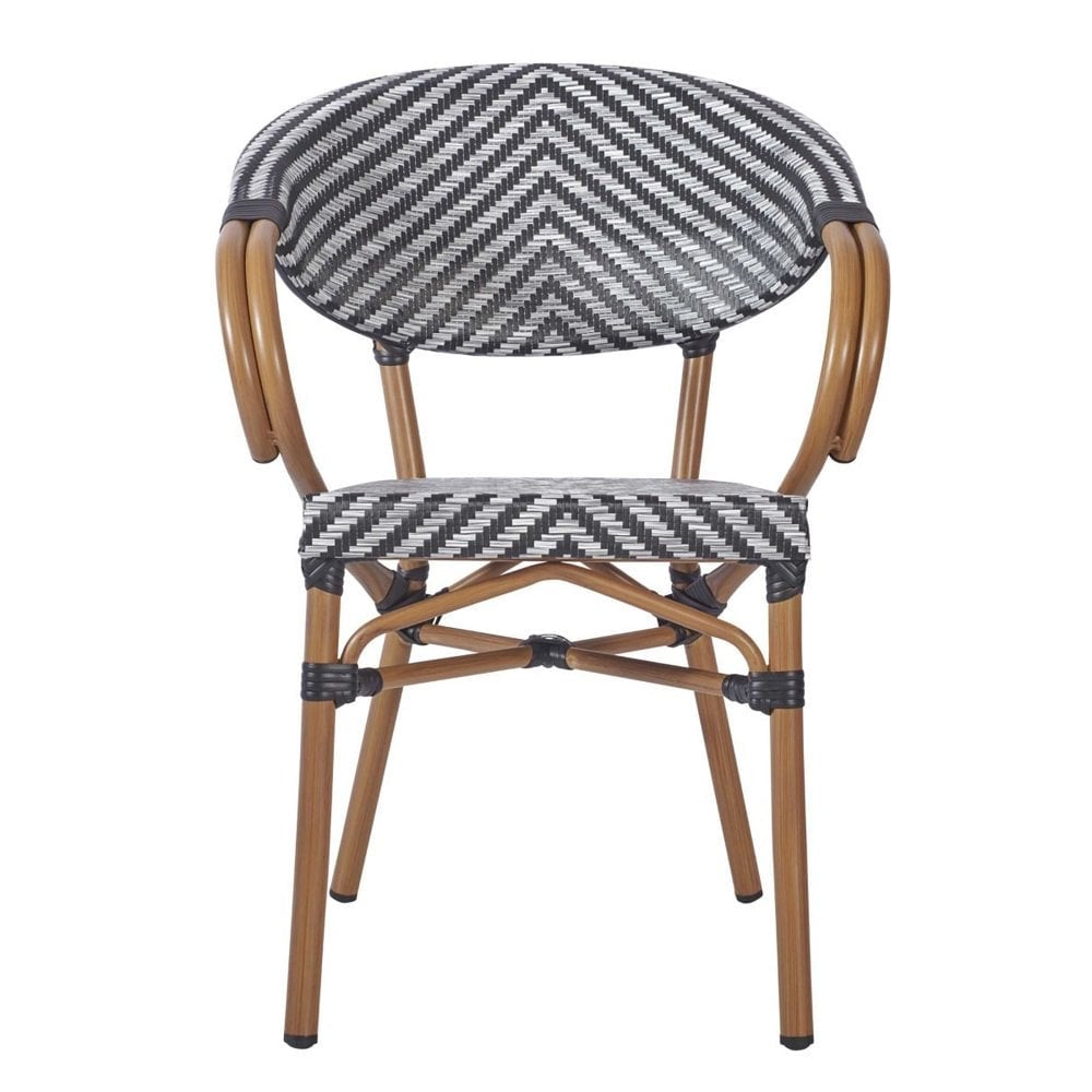 The Montpellier Bistro Outdoor Stacking Rattan Armchair features a black and white chevron weave, curved wooden armrests, and light brown legs—perfect as a waterproof outdoor chair for pub garden furniture settings.