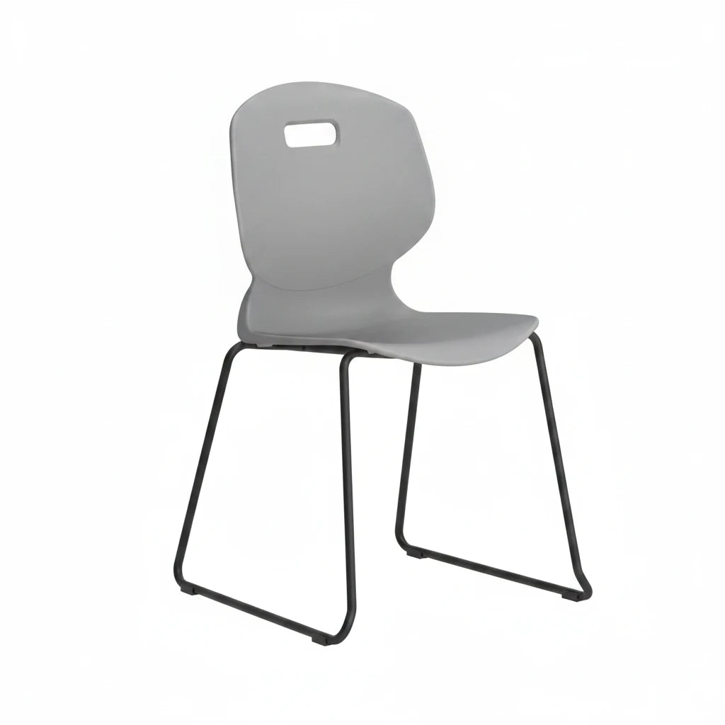 The Arc Classroom Skid Chair, featuring a gray plastic seat with a curved backrest, a small rectangular handle at the top, and black metal sled-style legs, is shown against a white background.