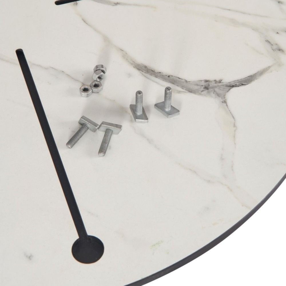 Close-up of the White Carrara Marble Outdoor Laminate Restaurant Table Top (12mm) with a marble-patterned surface, two black lines, and four metal fasteners—bolts, nuts, and square washers—placed on top.