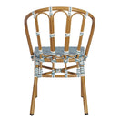 Switch The Bordeaux Outdoor Stacking Side Chair, shown from the back, features a bamboo-colored frame, decorative bindings, curved backrest, and an interwoven blue and white seat in a water-resistant rattan-style design. 3 image
