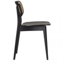 Switch The Gordona Black Rattan Effect Side Chair features a black beechwood frame, flat seat, and a woven cane backrest. This minimalist chair is shown in side view against a plain white background. 3 image