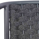 Switch Close-up of the Seville Outdoor Stacking Rattan Armchair back, showcasing a gray metal frame and tightly woven gray rattan in a basket-weave pattern—ideal for outdoor seating. 3 image