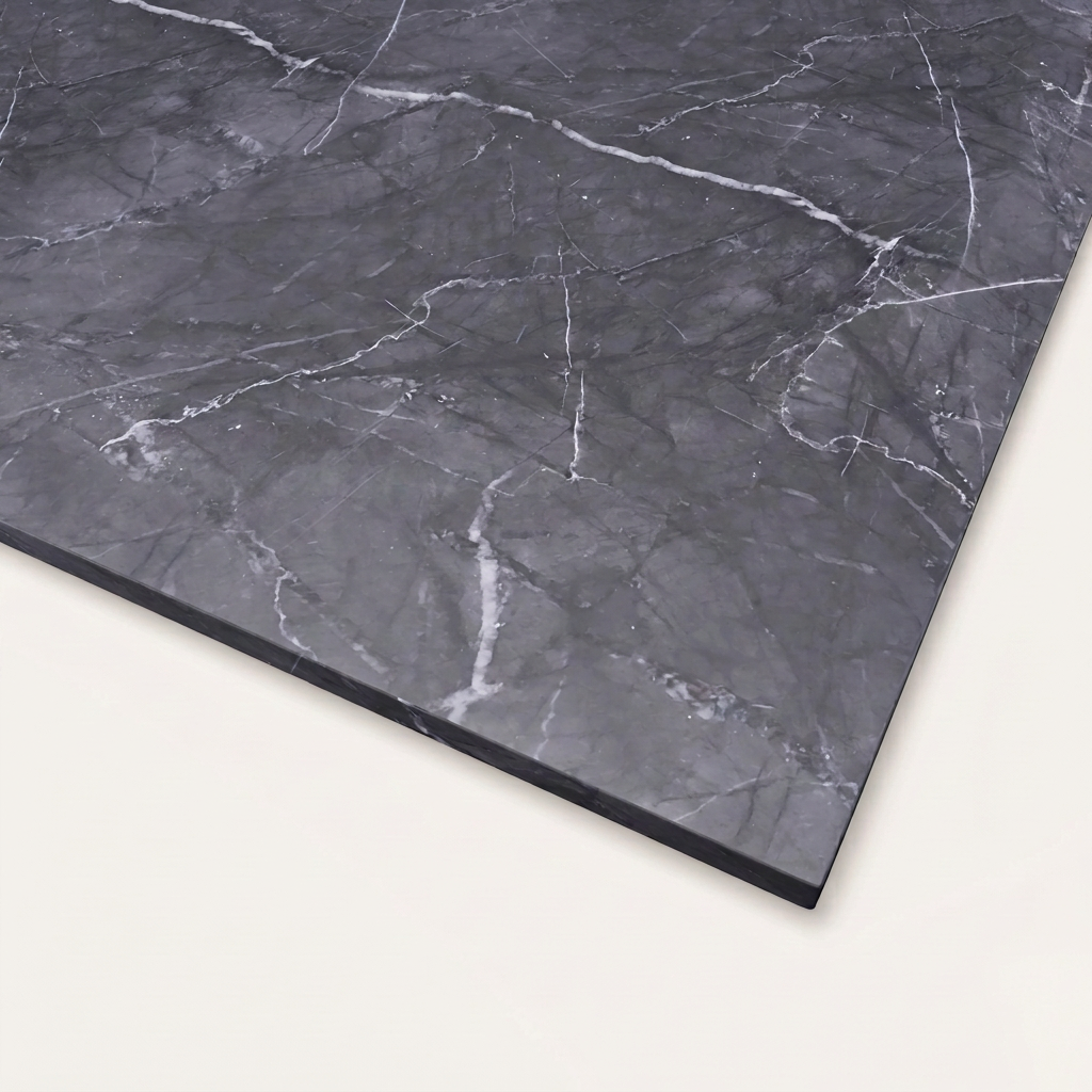 A close-up view of the Grigio Carnico Real Marble Restaurant Table Top - 20mm reveals its rectangular shape and striking black surface adorned with prominent white veins, making it an elegant choice for refined marble dining surfaces.