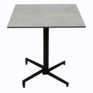 Switch The Rustic Concrete Outdoor Laminate Restaurant Table Top is a square table with a gray laminate surface and a black metal pedestal base with four outward legs, shown against a plain white background—perfect for outdoor commercial use. 2 image