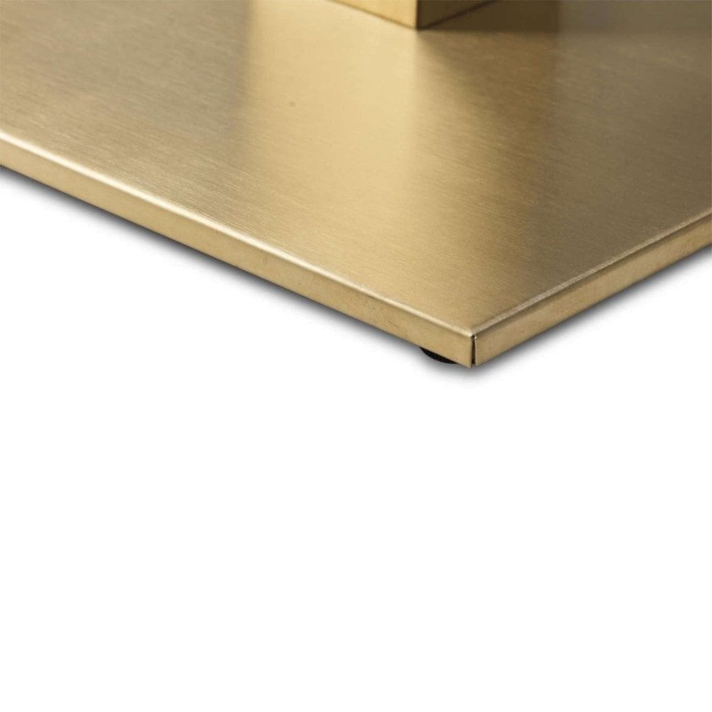 Close-up of the Cava Square Champagne Gold Table Base - Medium resting on a flat white surface, highlighting its precise edges and smooth metallic finish.