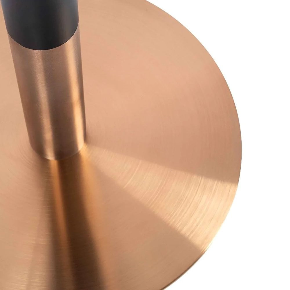 Close-up of the Zeus Rose Gold Table Base - Small, featuring a warm rose gold finish on its circular, brushed metallic base with subtle radial textures and a vertical cylindrical pole attached.
