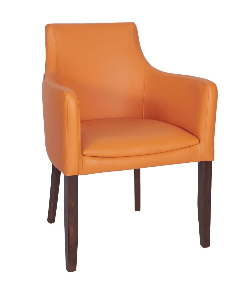 The Repton Upholstered Faux Leather Armchair is a modern dining chair with an orange faux leather seat and backrest, slightly curved armrests, and dark wooden legs.